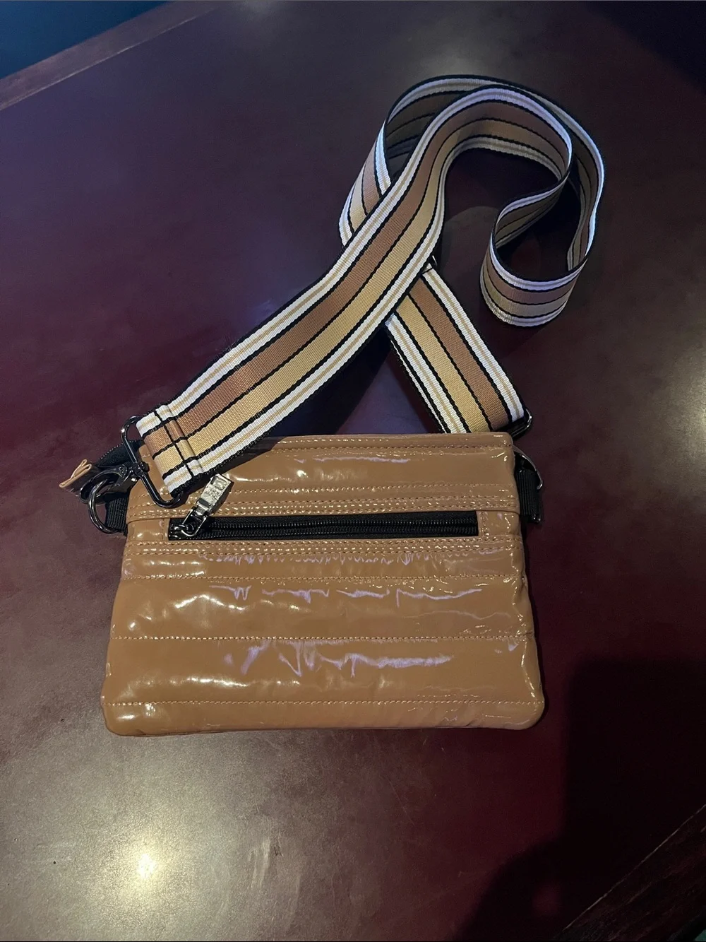 THINK ROYLN Glossy Tan Quilted Crossbody with Striped Strap